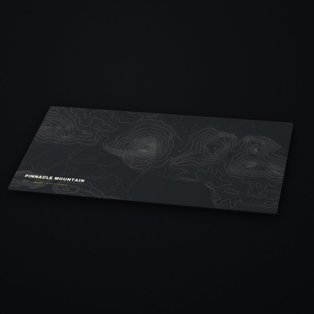 Pinnacle Mountain Topo Desk Mat at an angle on a dark desk