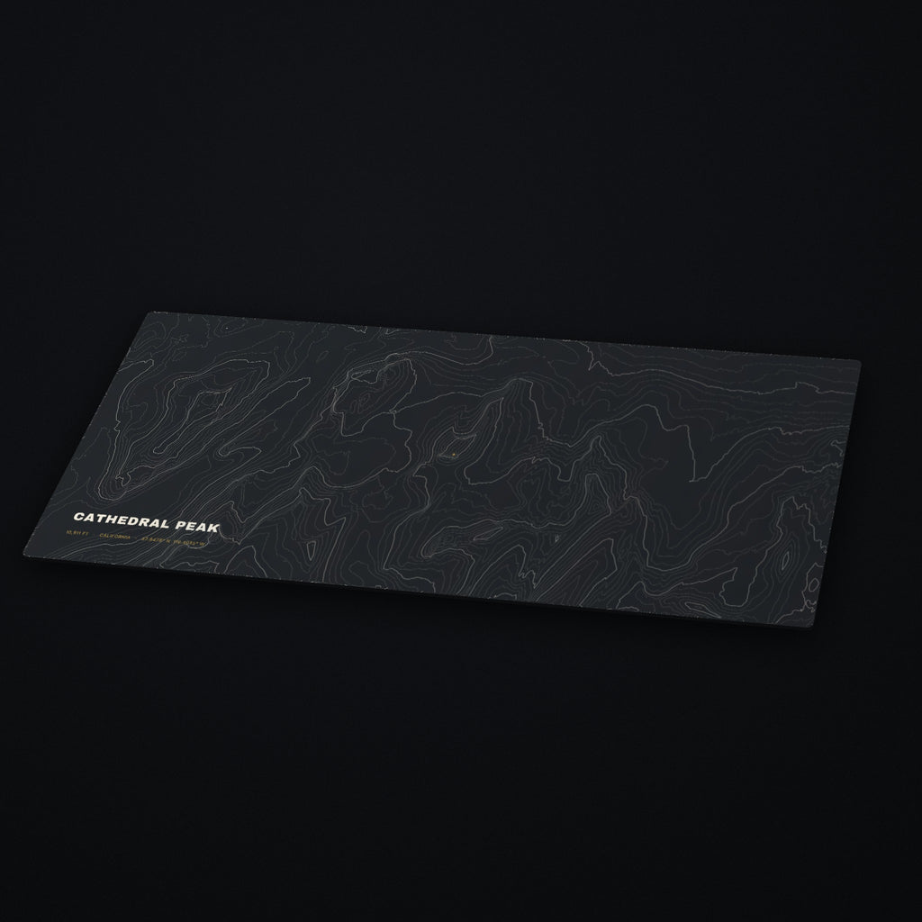 Cathedral Peak Topo Desk Mat at an angle on a dark desk