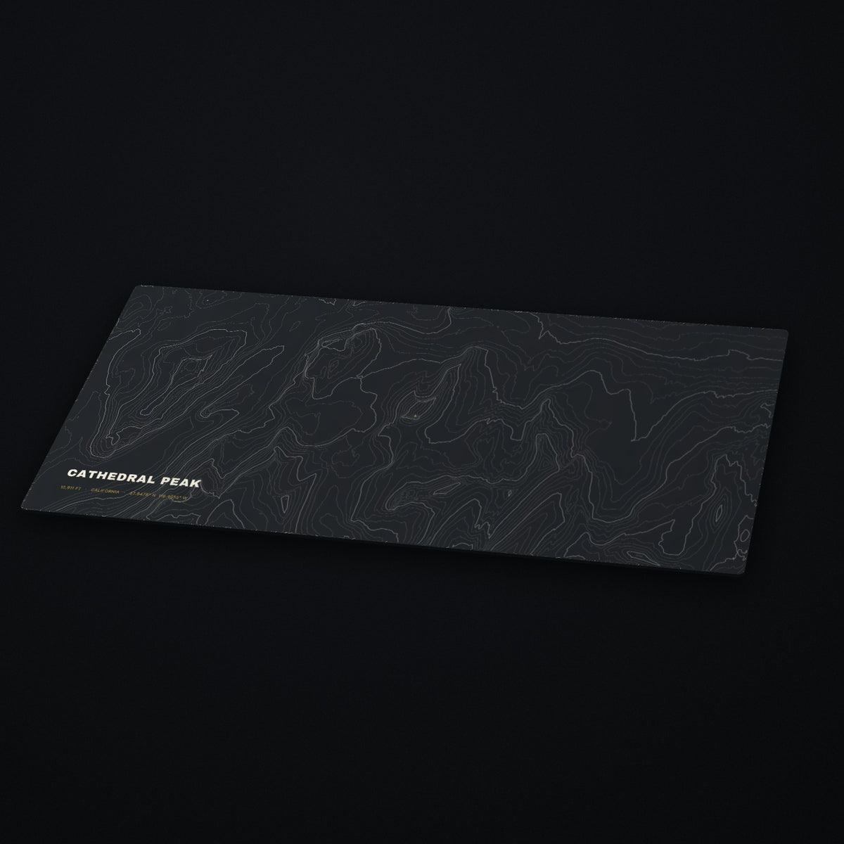 Cathedral Peak Topo Desk Mat at an angle on a dark desk