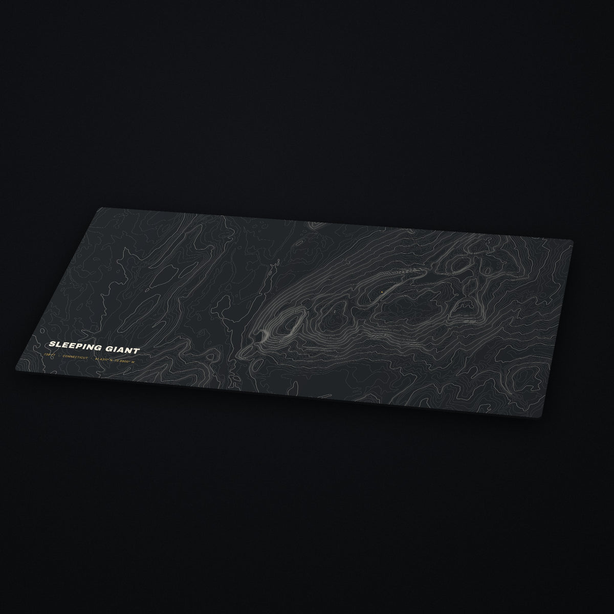 Sleeping Giant Topo Desk Mat at an angle on a dark desk