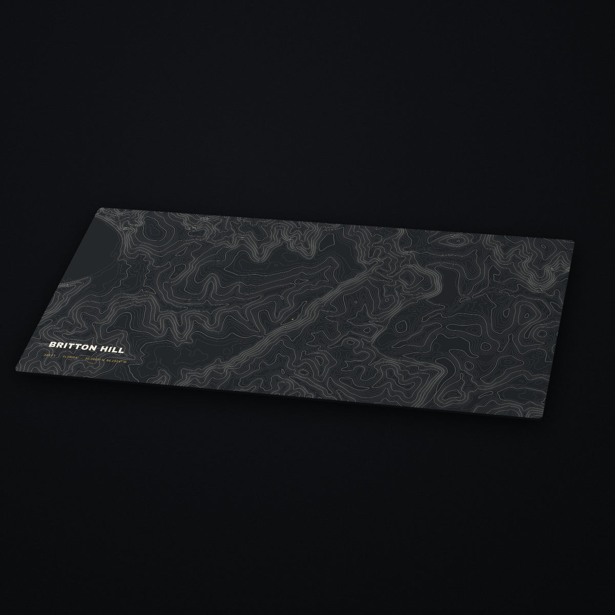 Britton Hill Topo Desk Mat at an angle on a dark desk
