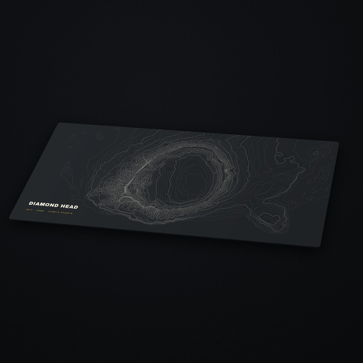 Diamond Head Topo Desk Mat at an angle on a dark desk