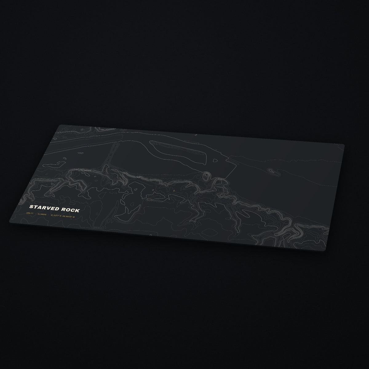 Starved Rock Topo Desk Mat at an angle on a dark desk