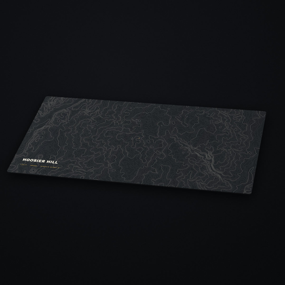 Hoosier Hill Topo Desk Mat at an angle on a dark desk