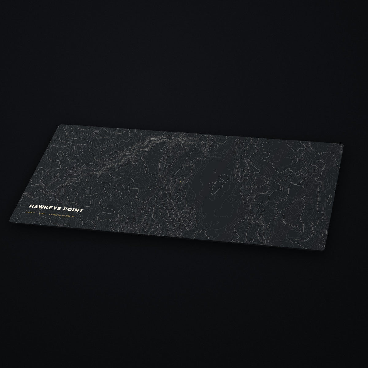 Hawkeye Point Topo Desk Mat at an angle on a dark desk