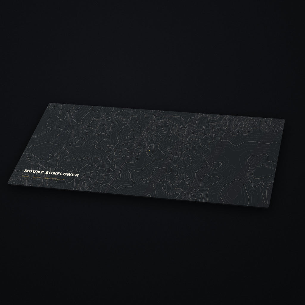 Mount Sunflower Topo Desk Mat at an angle on a dark desk