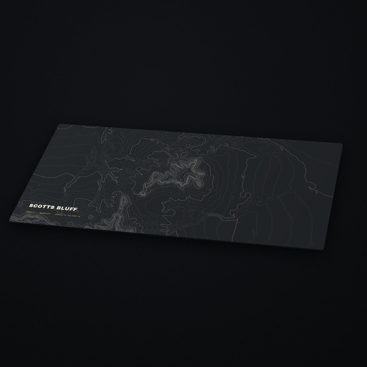 Scotts Bluff Topo Desk Mat at an angle on a dark desk