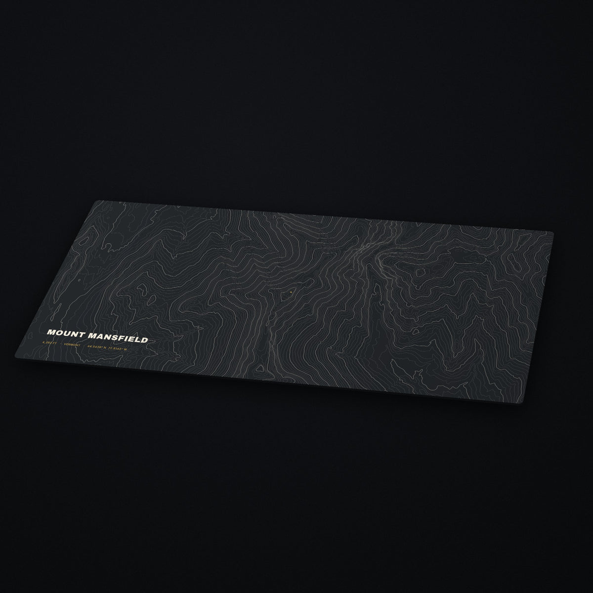 Mount Mansfield Topo Desk Mat at an angle on a dark desk