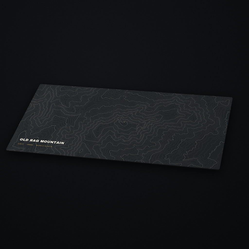 Old Rag Mountain Topo Desk Mat at an angle on a dark desk
