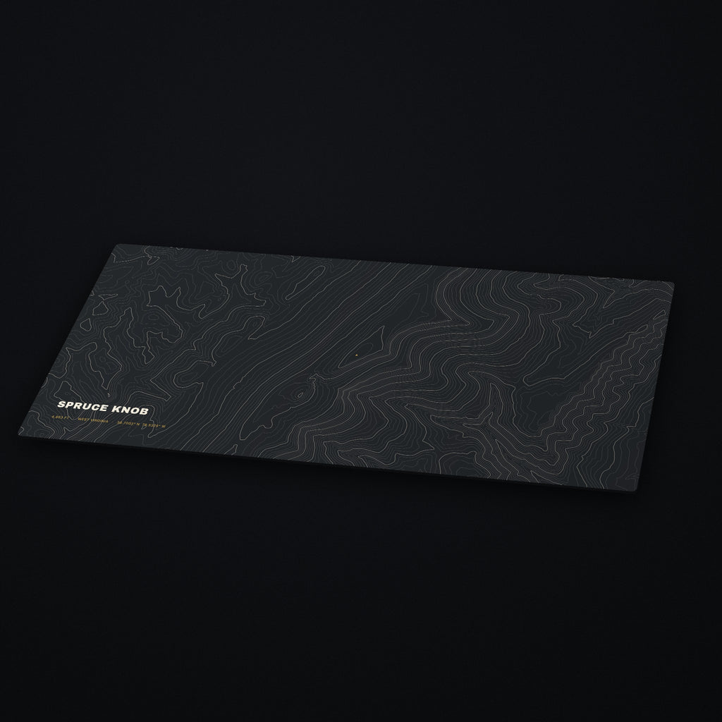 Spruce Knob Topo Desk Mat at an angle on a dark desk