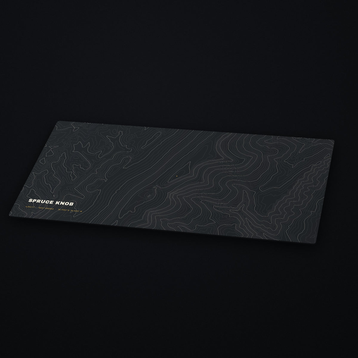 Spruce Knob Topo Desk Mat at an angle on a dark desk