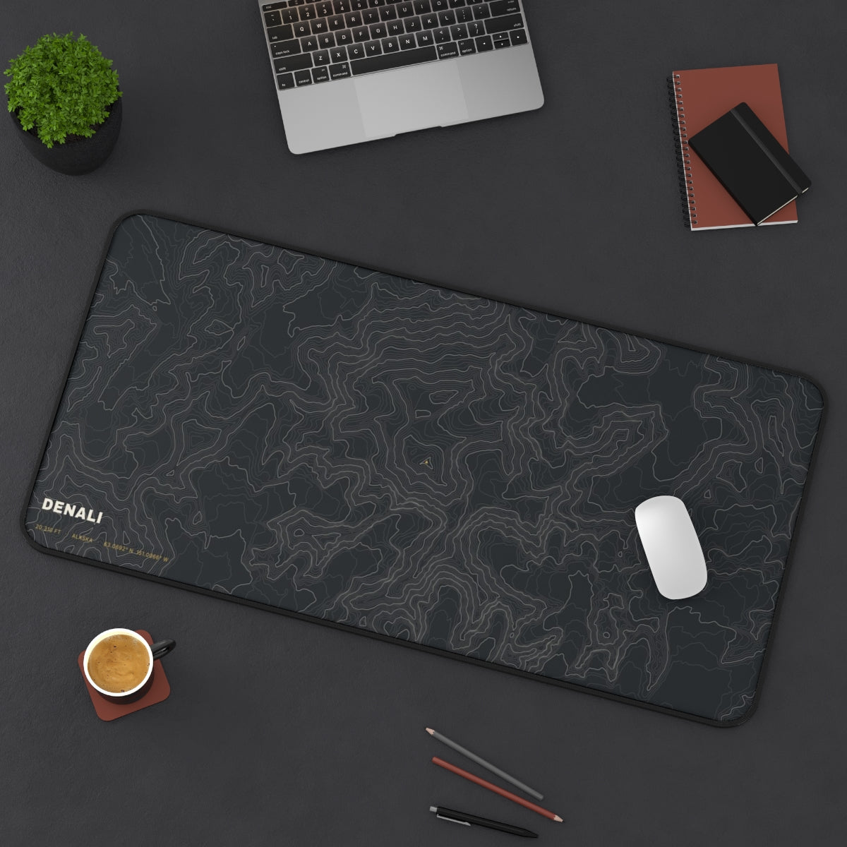 Denali Topo desk mat on a desk with a laptop, mouse and coffee cup for scale