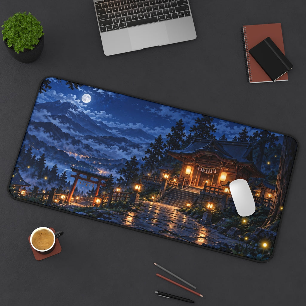 Lantern Shrine desk mat on a desk with a laptop, mouse and coffee cup for scale