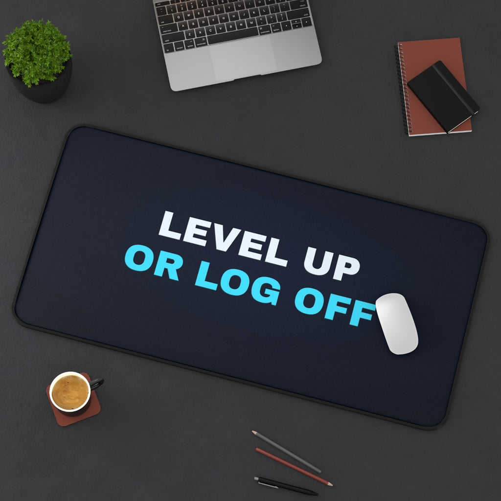 Level Up or Log Off desk mat on a desk with a laptop, mouse and coffee cup for scale