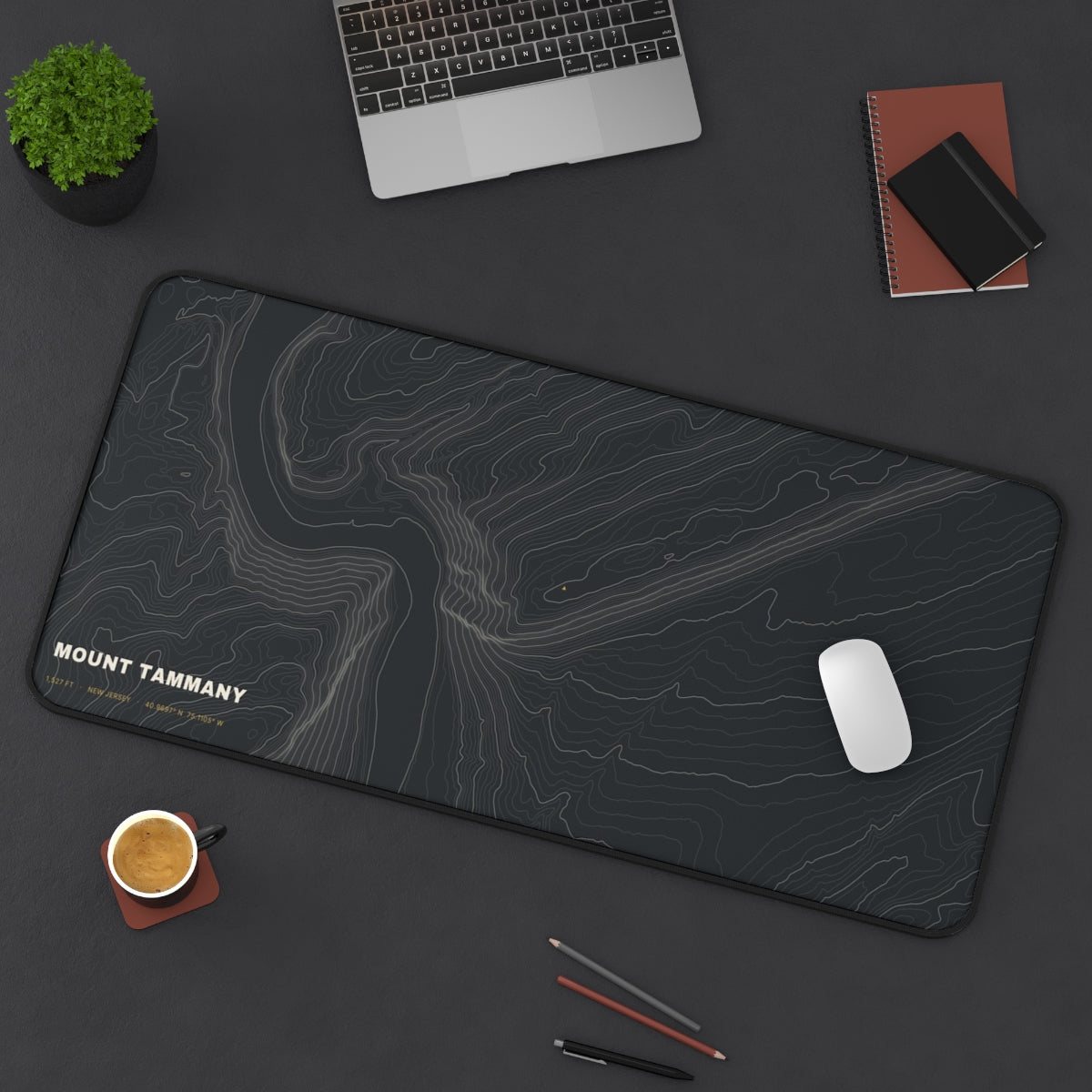 Mount Tammany Topo desk mat on a desk with a laptop, mouse and coffee cup for scale