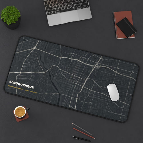 Albuquerque Street Map desk mat on a desk with a laptop, mouse and coffee cup for scale
