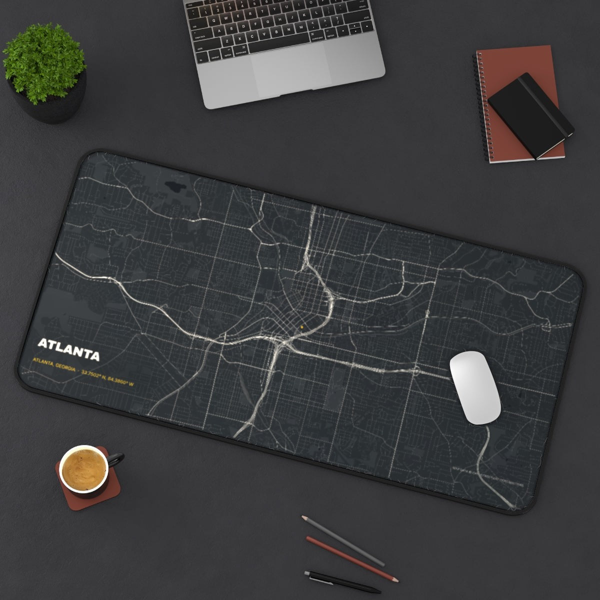 Atlanta Street Map desk mat on a desk with a laptop, mouse and coffee cup for scale