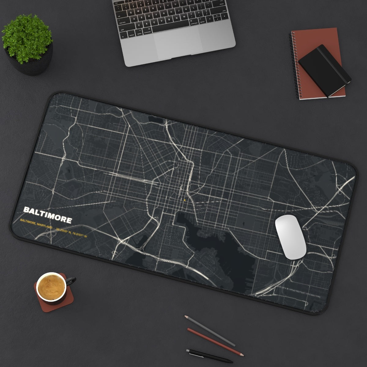 Baltimore Street Map desk mat on a desk with a laptop, mouse and coffee cup for scale