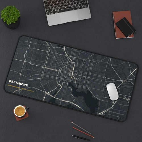 Baltimore Street Map desk mat on a desk with a laptop, mouse and coffee cup for scale