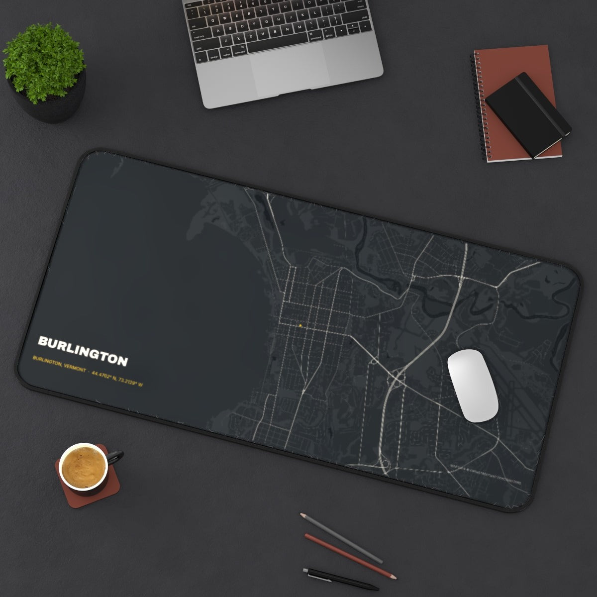 Burlington Street Map desk mat on a desk with a laptop, mouse and coffee cup for scale