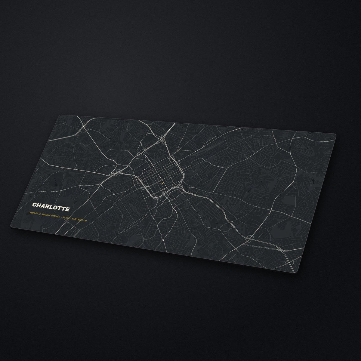 Charlotte Street Map Desk Mat at an angle on a stone desk
