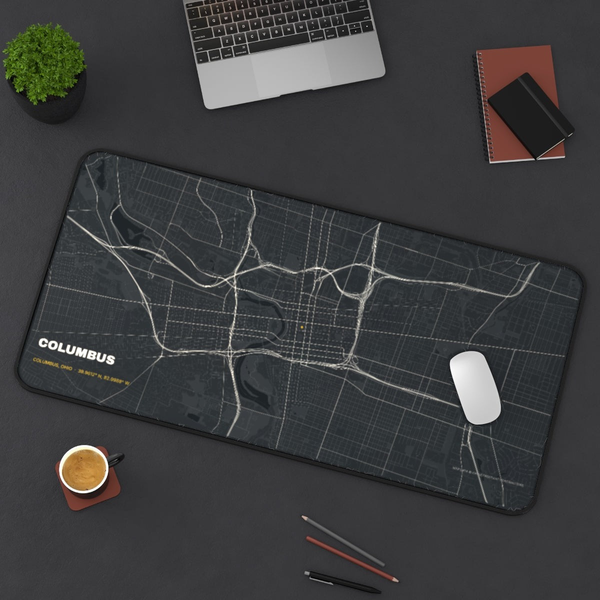 Columbus Street Map desk mat on a desk with a laptop, mouse and coffee cup for scale