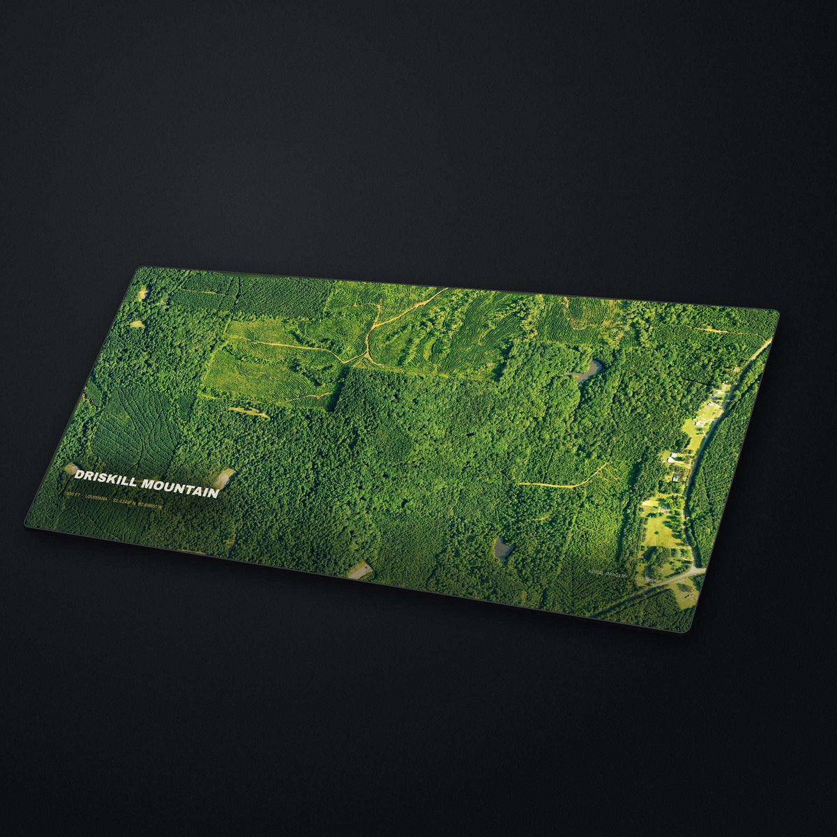 Driskill Mountain Satellite Desk Mat at an angle on a stone desk