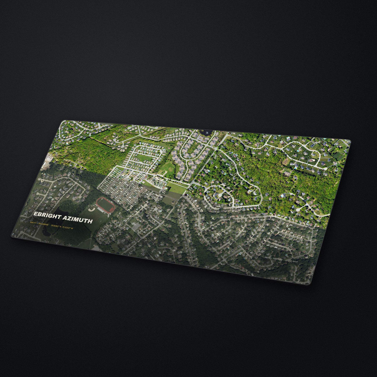 Ebright Azimuth Satellite Desk Mat at an angle on a stone desk