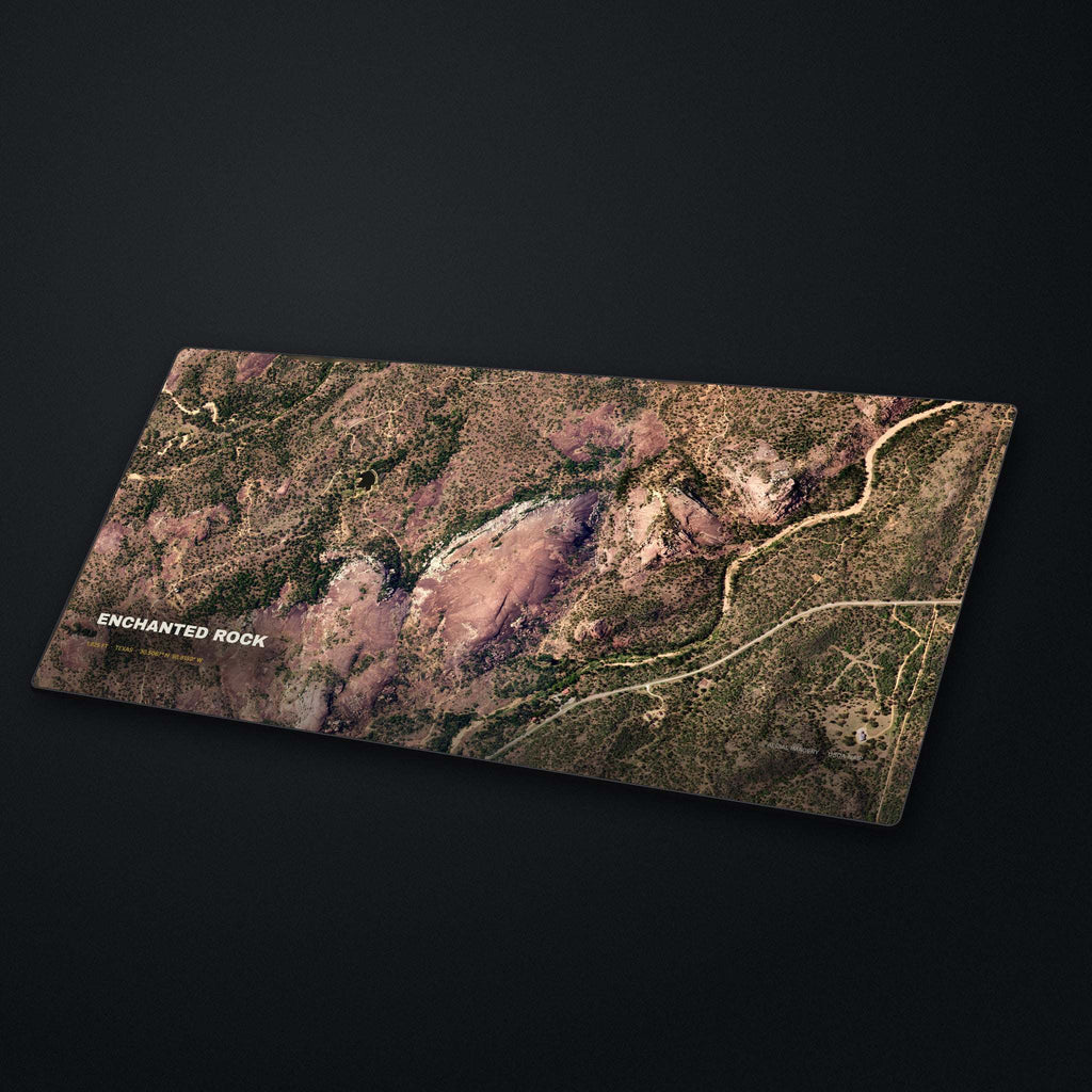 Enchanted Rock Satellite Desk Mat at an angle on a stone desk