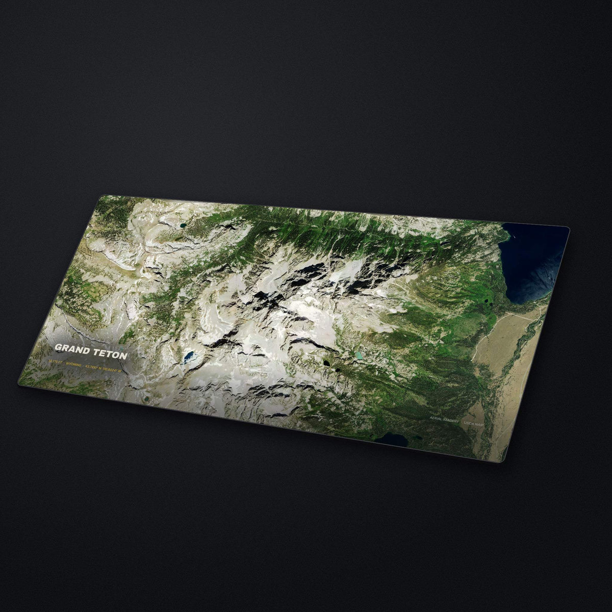 Grand Teton Satellite Desk Mat at an angle on a stone desk