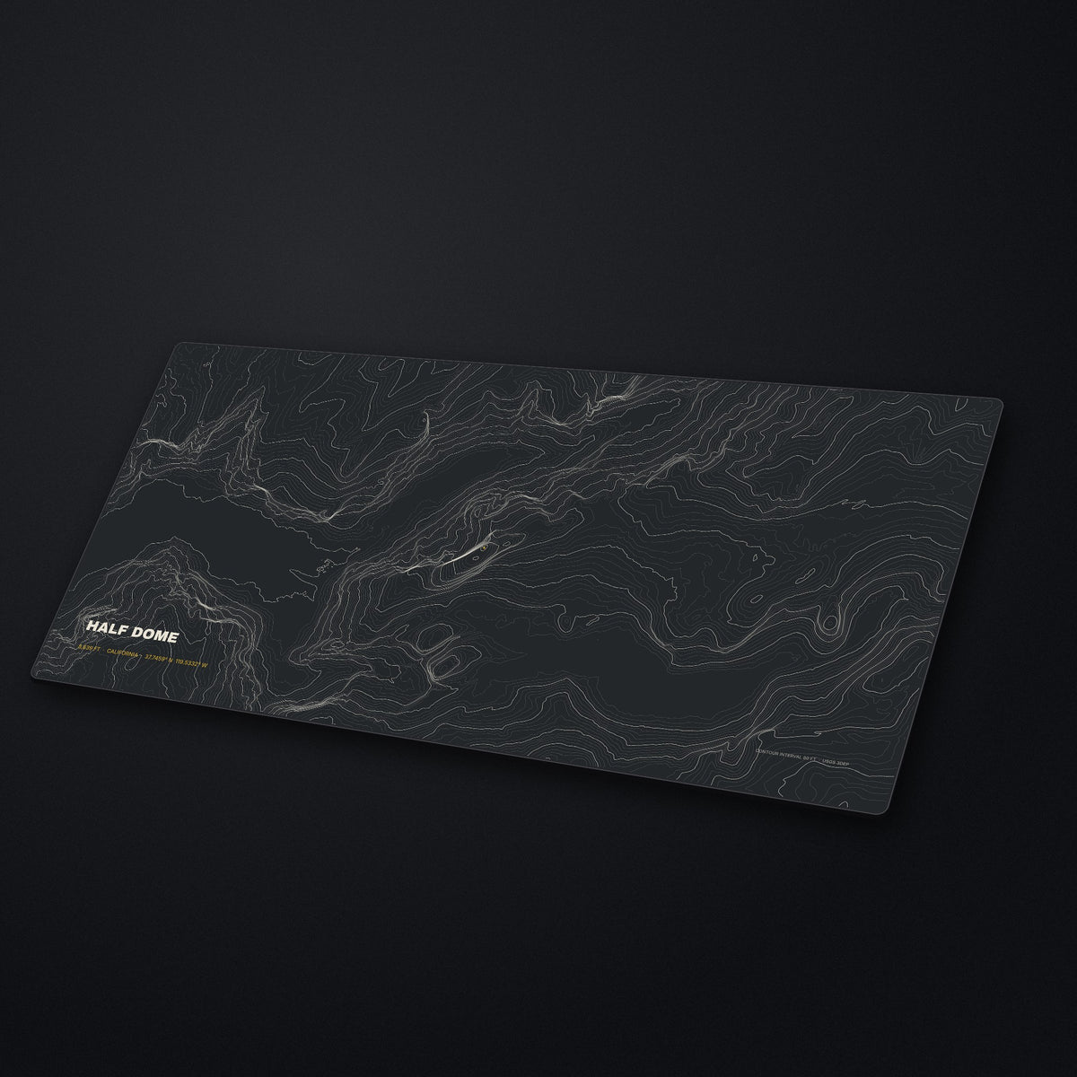 Half Dome Topo Desk Mat at an angle on a stone desk