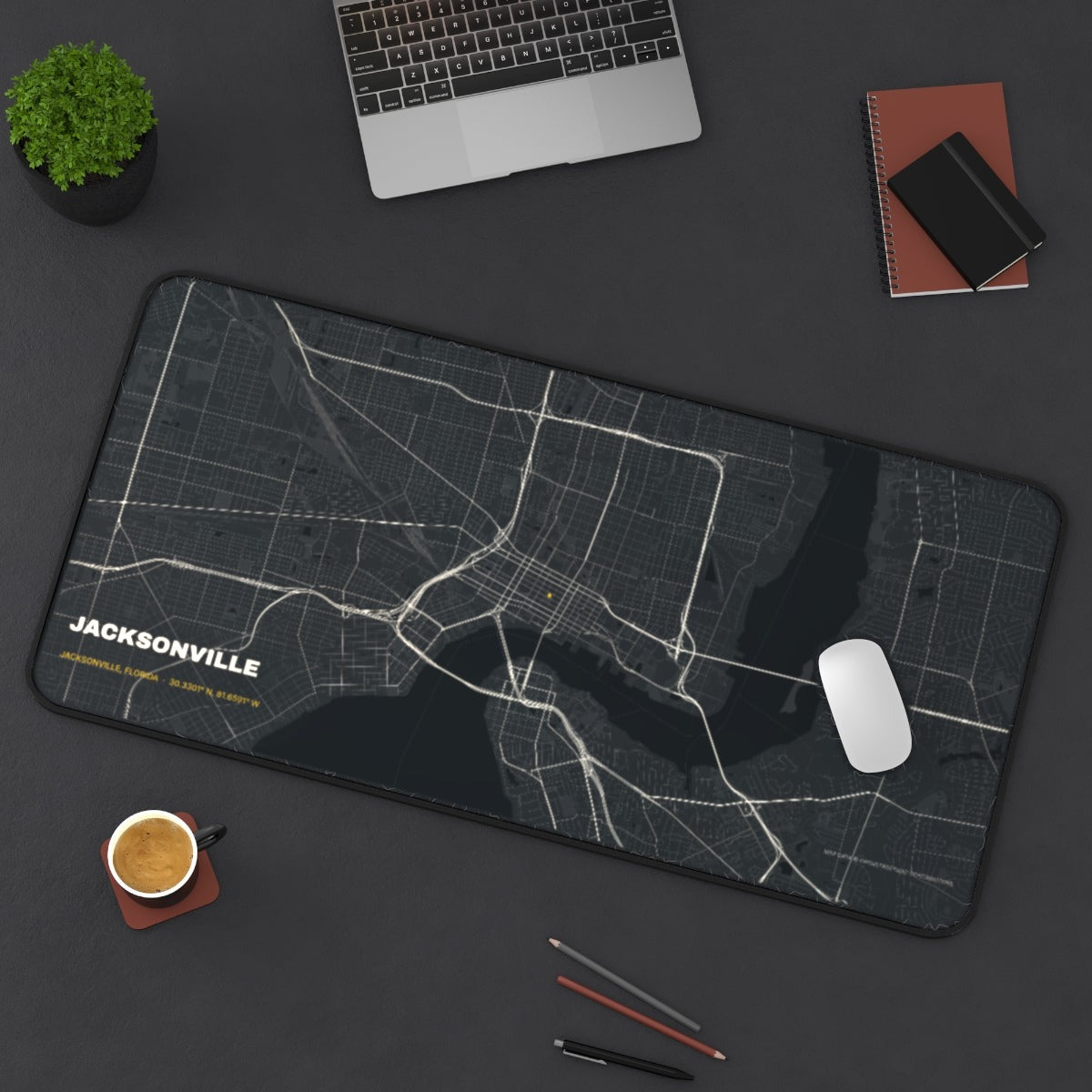 Jacksonville Street Map desk mat on a desk with a laptop, mouse and coffee cup for scale