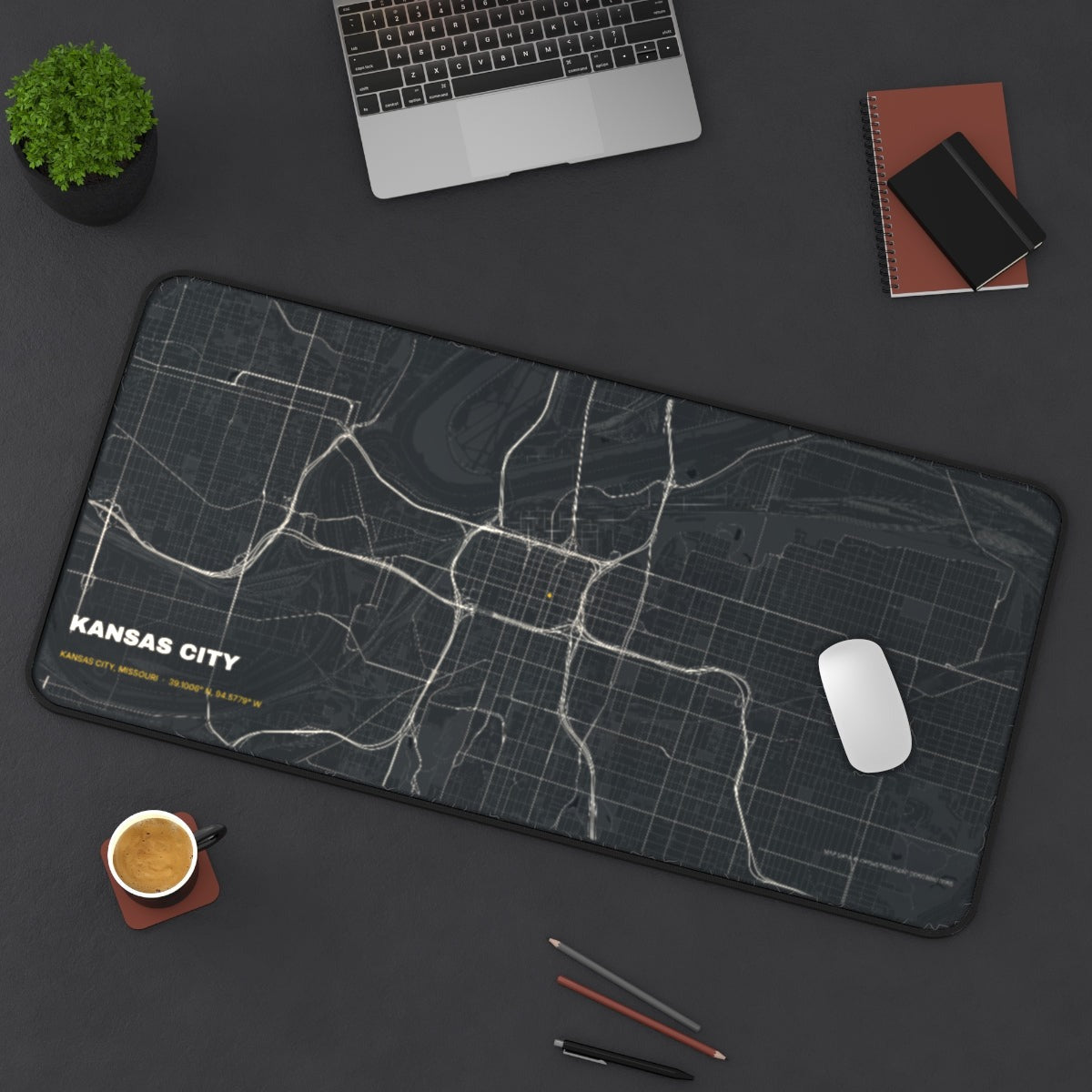 Kansas City Street Map desk mat on a desk with a laptop, mouse and coffee cup for scale