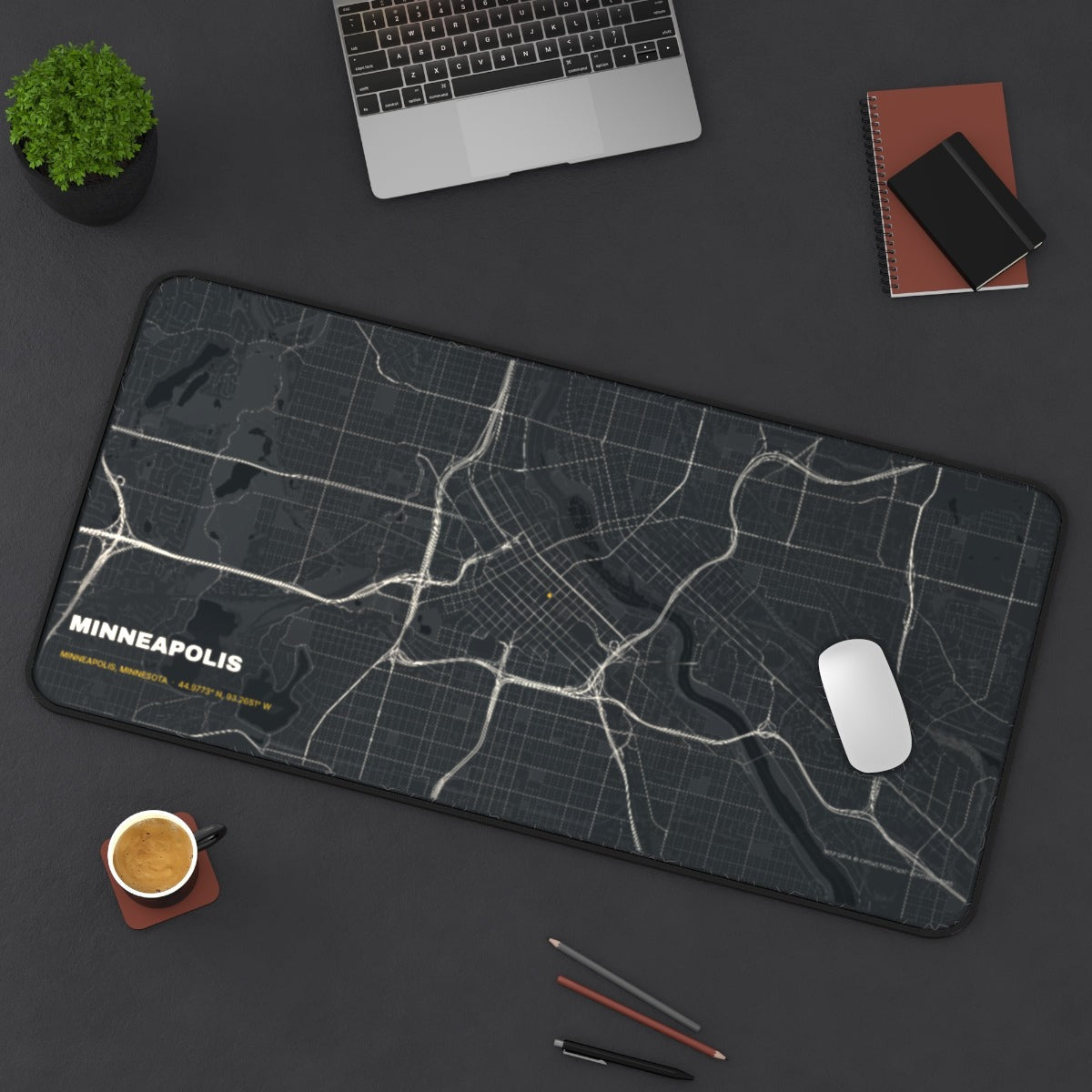 Minneapolis Street Map desk mat on a desk with a laptop, mouse and coffee cup for scale