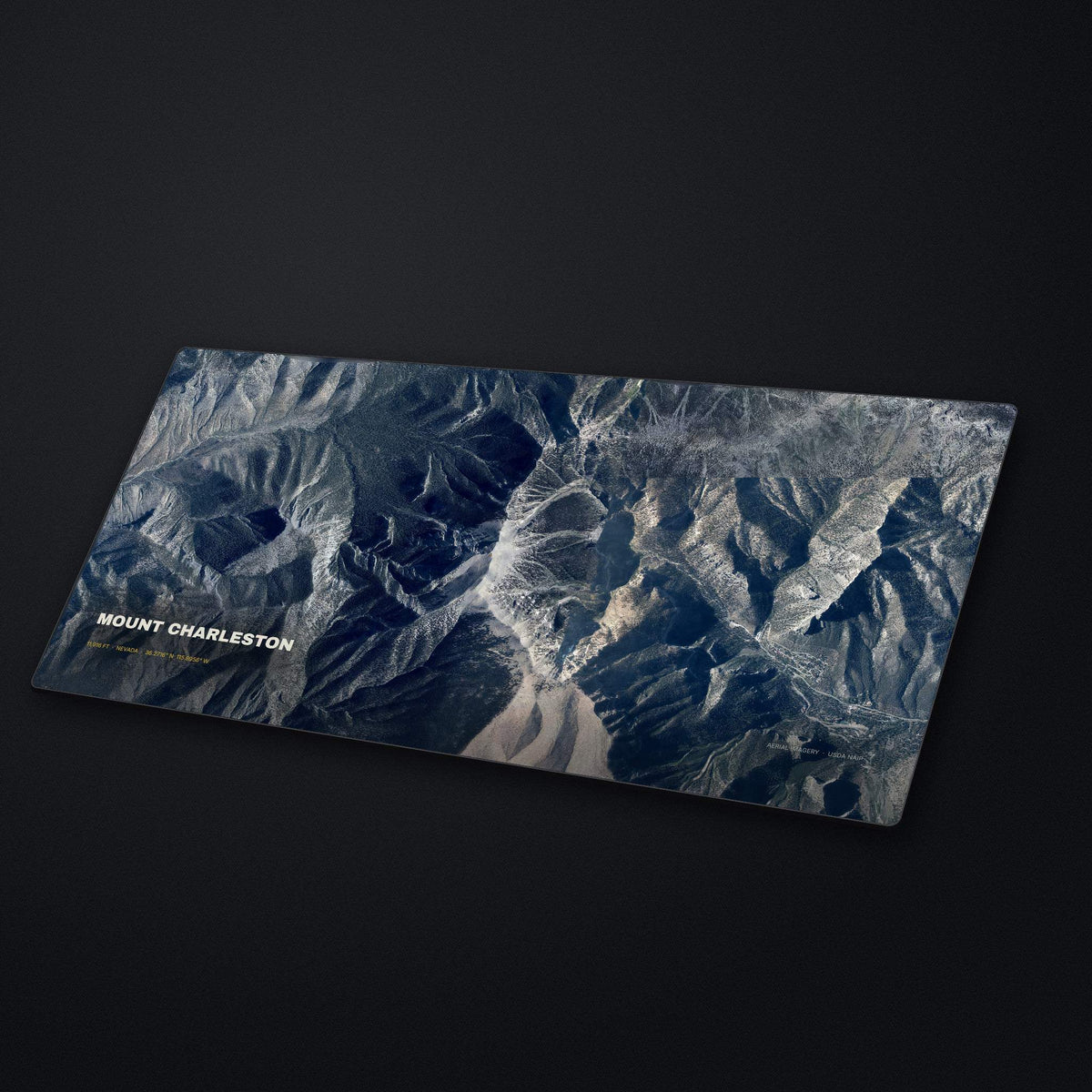 Mount Charleston Satellite Desk Mat at an angle on a stone desk