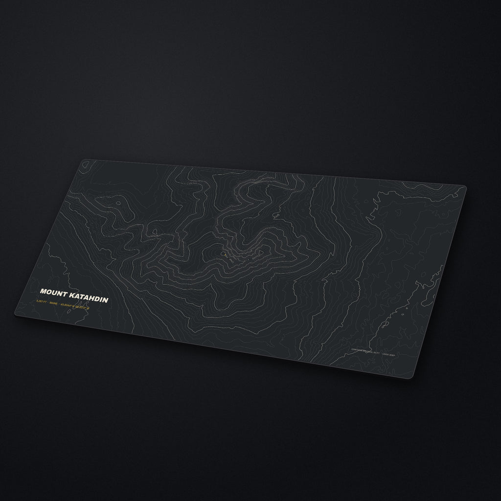 Mount Katahdin Topo Desk Mat at an angle on a stone desk
