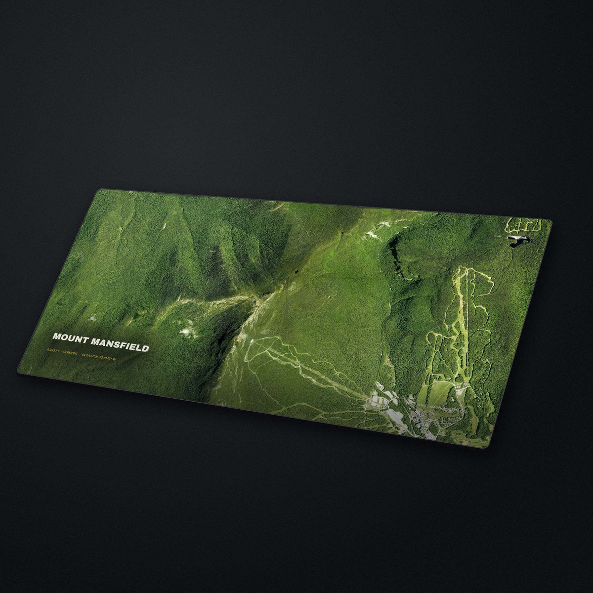 Mount Mansfield Satellite Desk Mat at an angle on a stone desk