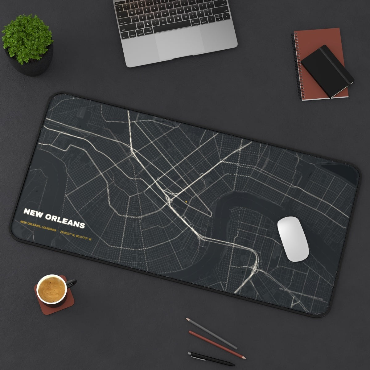 New Orleans Street Map desk mat on a desk with a laptop, mouse and coffee cup for scale