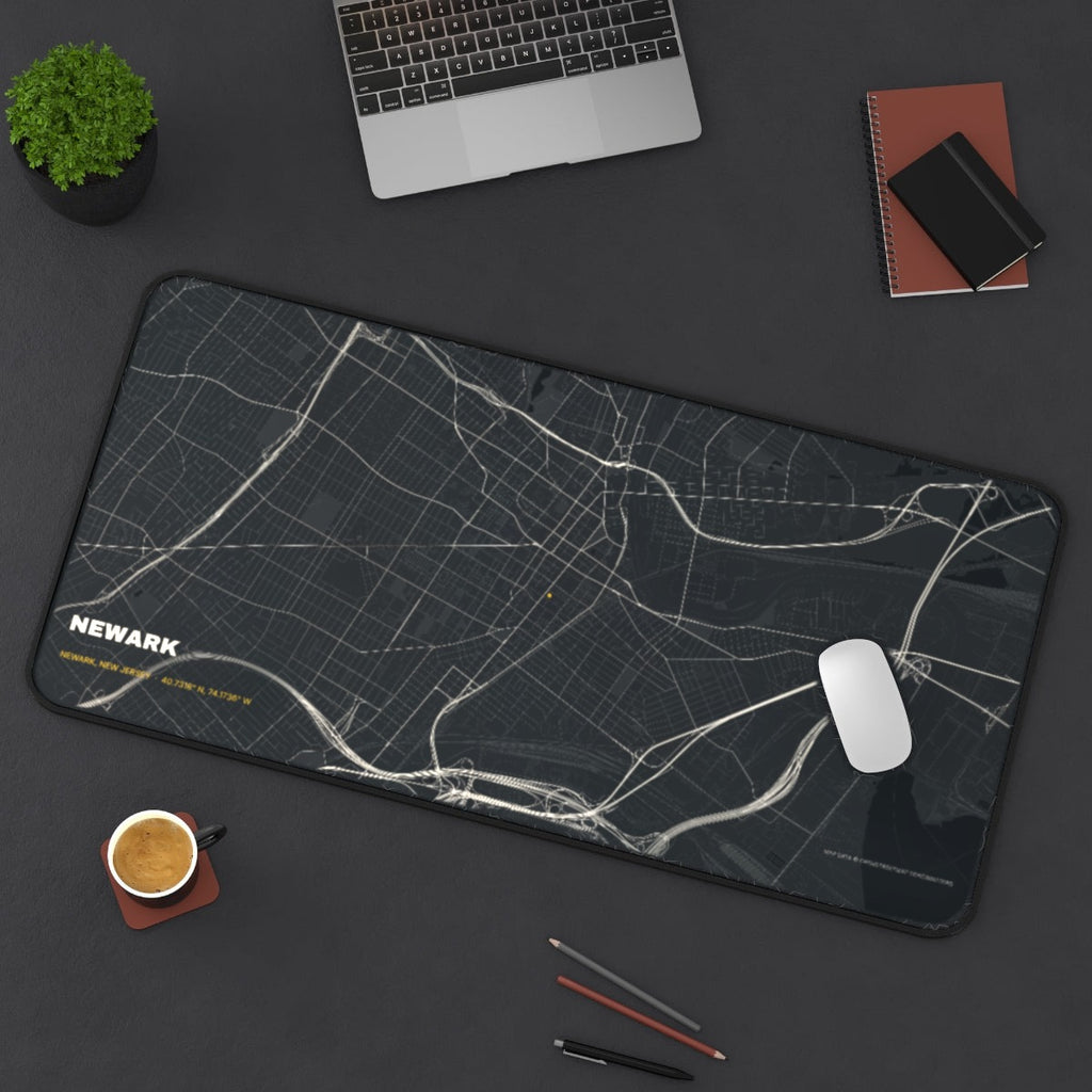 Newark Street Map desk mat on a desk with a laptop, mouse and coffee cup for scale