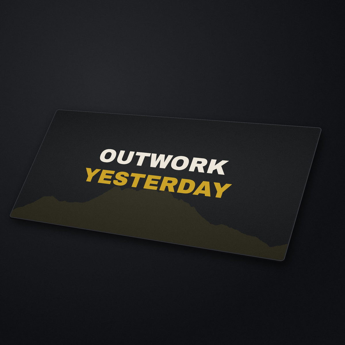 Outwork Yesterday Desk Mat at an angle on a stone desk