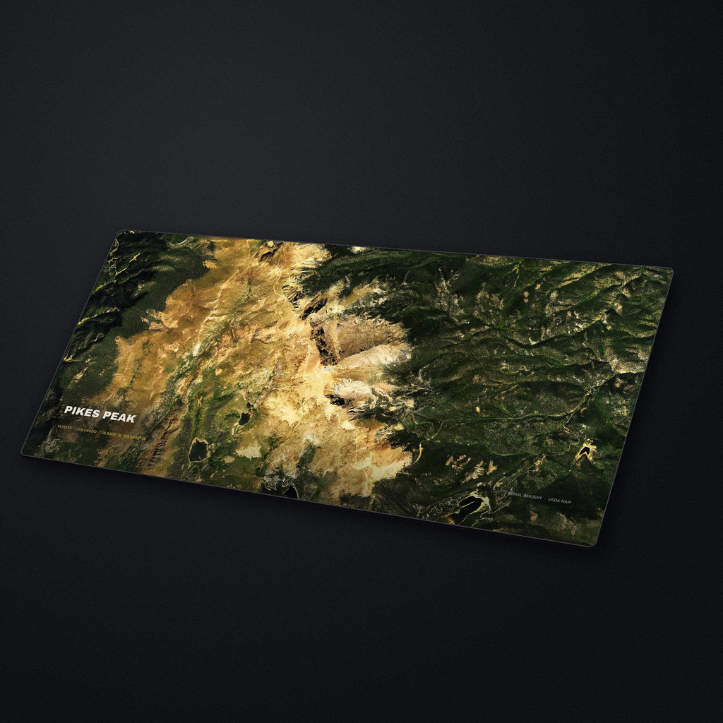 Pikes Peak Satellite Desk Mat at an angle on a stone desk