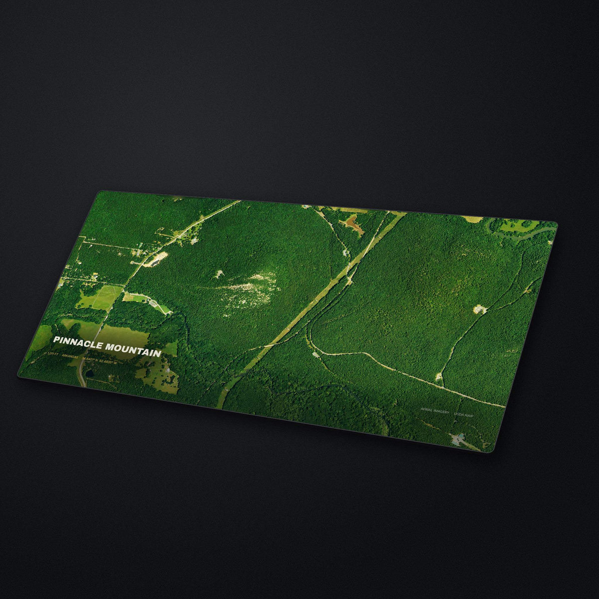 Pinnacle Mountain Satellite Desk Mat at an angle on a stone desk