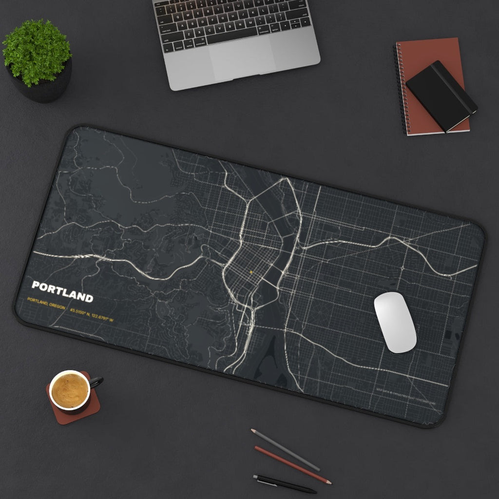 Portland Street Map desk mat on a desk with a laptop, mouse and coffee cup for scale
