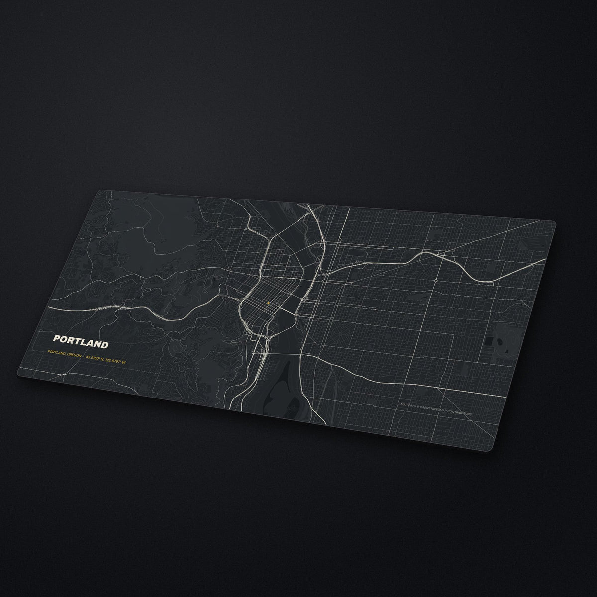 Portland Street Map Desk Mat at an angle on a stone desk