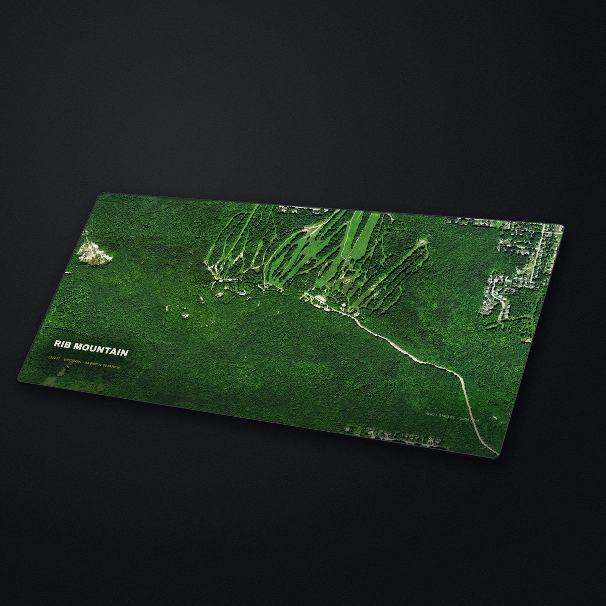 Rib Mountain Satellite Desk Mat at an angle on a stone desk