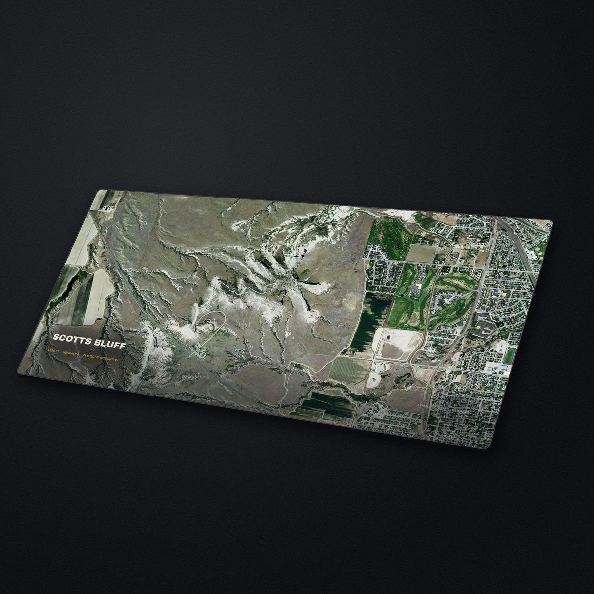 Scotts Bluff Satellite Desk Mat at an angle on a stone desk