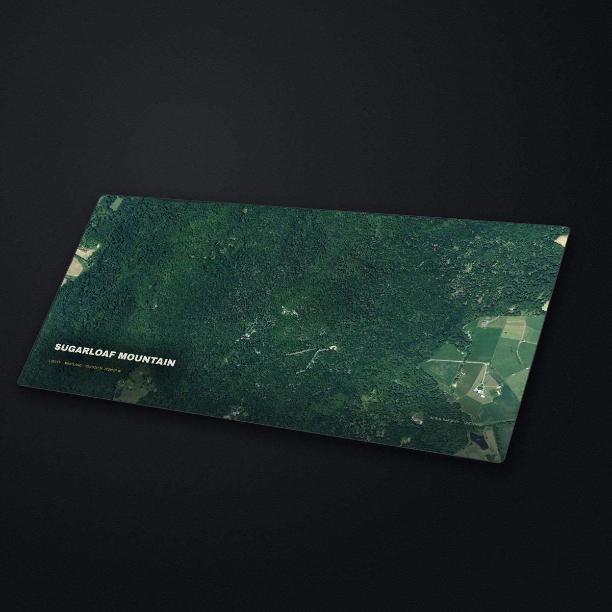 Sugarloaf Mountain Satellite Desk Mat at an angle on a stone desk
