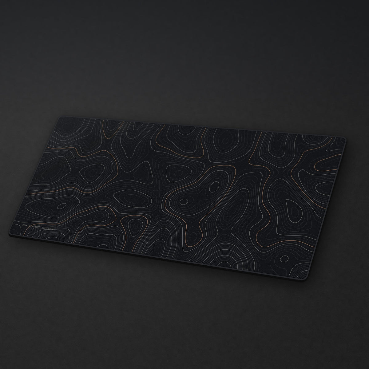 Topo Desk Mat at an angle on a stone desk
