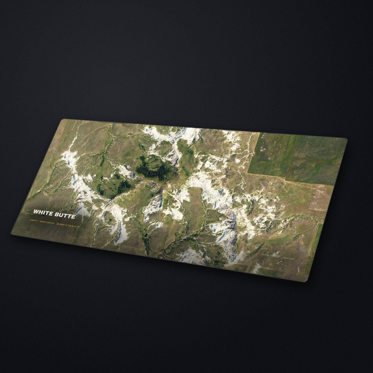 White Butte Satellite Desk Mat at an angle on a stone desk