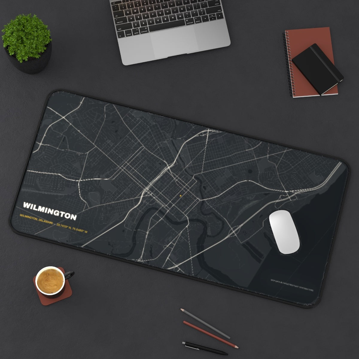 Wilmington Street Map desk mat on a desk with a laptop, mouse and coffee cup for scale